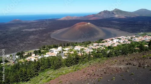 Volcanic Island Paradise: Aerial View of Coastal Town Nestled in Volcanic Landscape