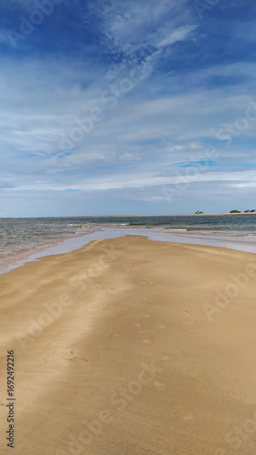 Endless shades of blue paint the horizon at Castelhanos Beach, a natural paradise on Boipeba Island, Bahia.
