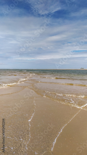 Endless shades of blue paint the horizon at Castelhanos Beach, a natural paradise on Boipeba Island, Bahia.