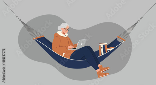 Elderly woman working or relaxing on a laptop in a hammock with books. Represents remote work, retirement, leisure, and comfortable digital connection.