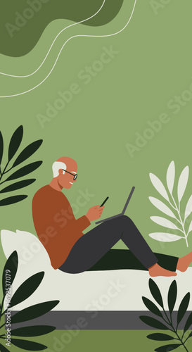 Smiling senior man comfortably uses a laptop and smartphone at home, showcasing modern digital connectivity, remote work, or leisure for older adults.