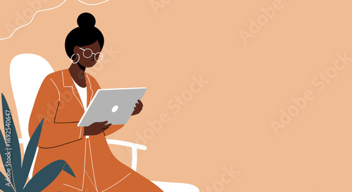 Focused Black woman using a laptop while sitting in a modern, comfortable setting. Ideal for remote work, online learning, technology, and modern lifestyle themes.