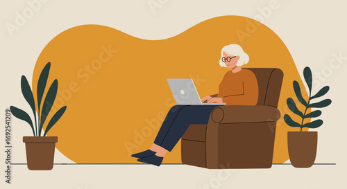 An elderly woman comfortably uses her laptop from an armchair at home, depicting remote work, digital literacy, and a relaxed modern lifestyle for seniors.