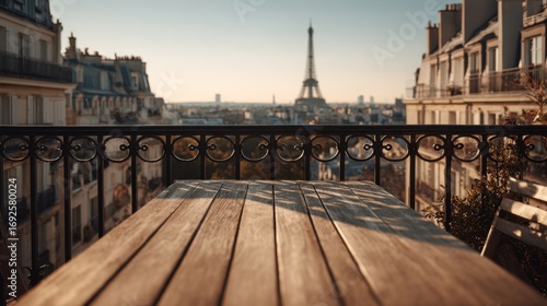 Empty wooden table on balcony with Eiffel Tower view at golden hour Paris skyline