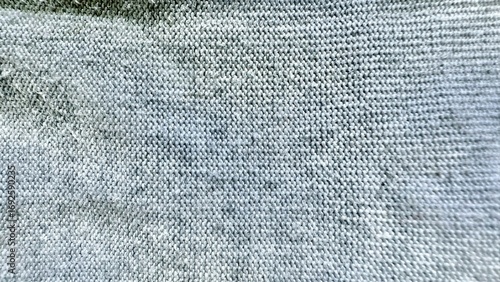soft gray knitted fabric texture with subtle threads and natural folds for minimalist background wallpaper or editorial design
