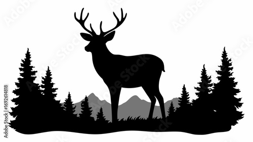 Silhouette of a deer with antlers standing in a forest with pine trees and mountains in the background
