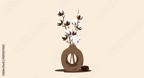 Aesthetic arrangement of cotton stems in a modern ceramic vase with a decorative base