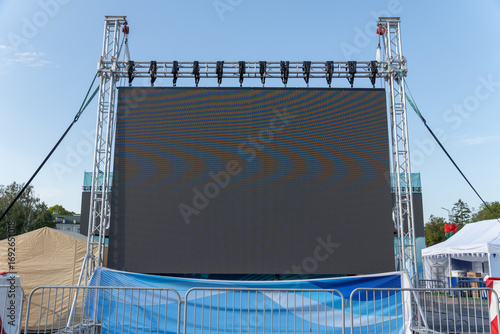 Large LED screen displaying stage performance