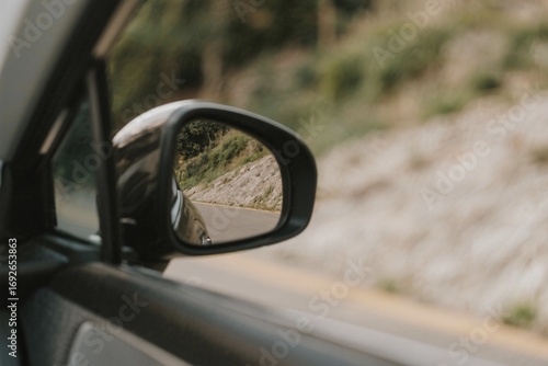 Looking Back While Driving on a Scenic Road