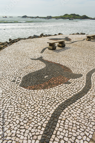 Portuguese style pavement with a whale pattern on the promenade of Armaçao beach - Florianopolis, Brazil