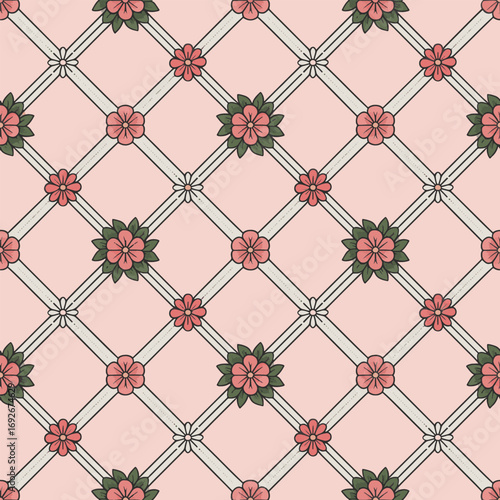 Romantic victorian lattice pattern with delicate pink flowers and green leaves creating an elegant seamless design for vintage wallpaper fabric wrapping paper and home decor projects