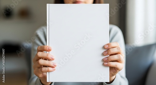 Woman Holding Blank White Book Cover Mockup.