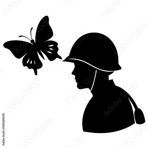 Soldier in silhouette observing a butterfly