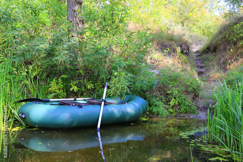 Inflatable boat for fishing on the river bank