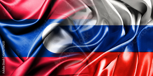 The national flags of Russia and Laos are combined into one and placed side by side on a fluttering cotton background. Flags.
