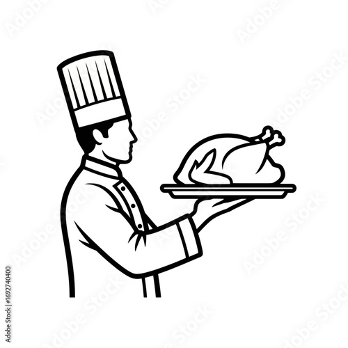 A chef holding a tray with turkey