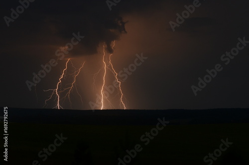 Lightning strikes the field at night