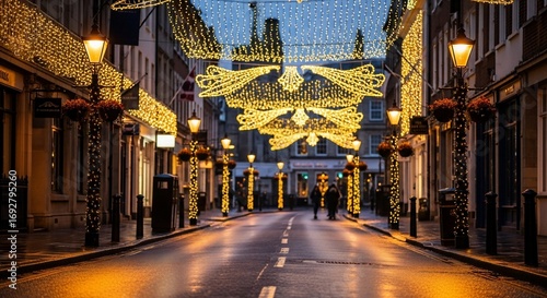 Festive street scene with golden Christmas lights and wet pavement at dusk