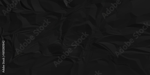 Wrinkle cardboard recycled ripped creased black crumple aged closeup craft document grunge recycling paper background.	
