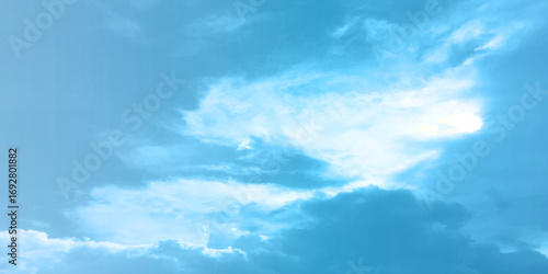 Blue clouds, sunny sunlight effect on the white fluffy clouds, rainy day, fresh natural weather background banner marketing image, surface splashed love day gift 