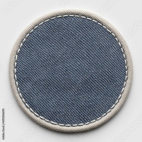 Wallpaper Mural A hand crafted round circular circle dark blue denim patch with white stitching and white border edge in white background, custom fashion label patch template for logo, name, uniform design Torontodigital.ca