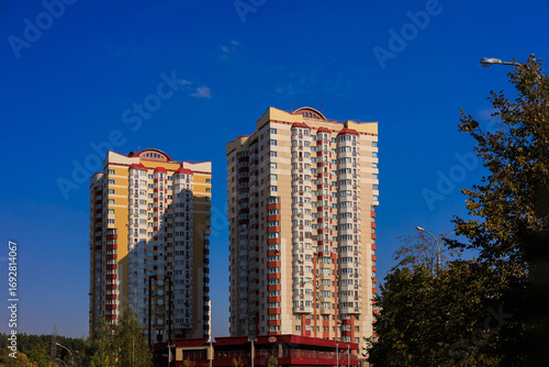Canvas Print City view, modern buildings and skyscrapers against the blue sky.