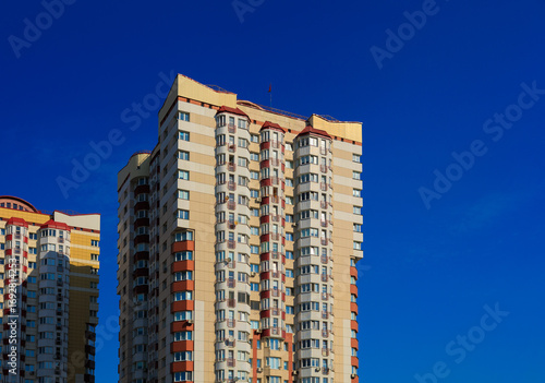 Canvas Print City view, modern buildings and skyscrapers against the blue sky.