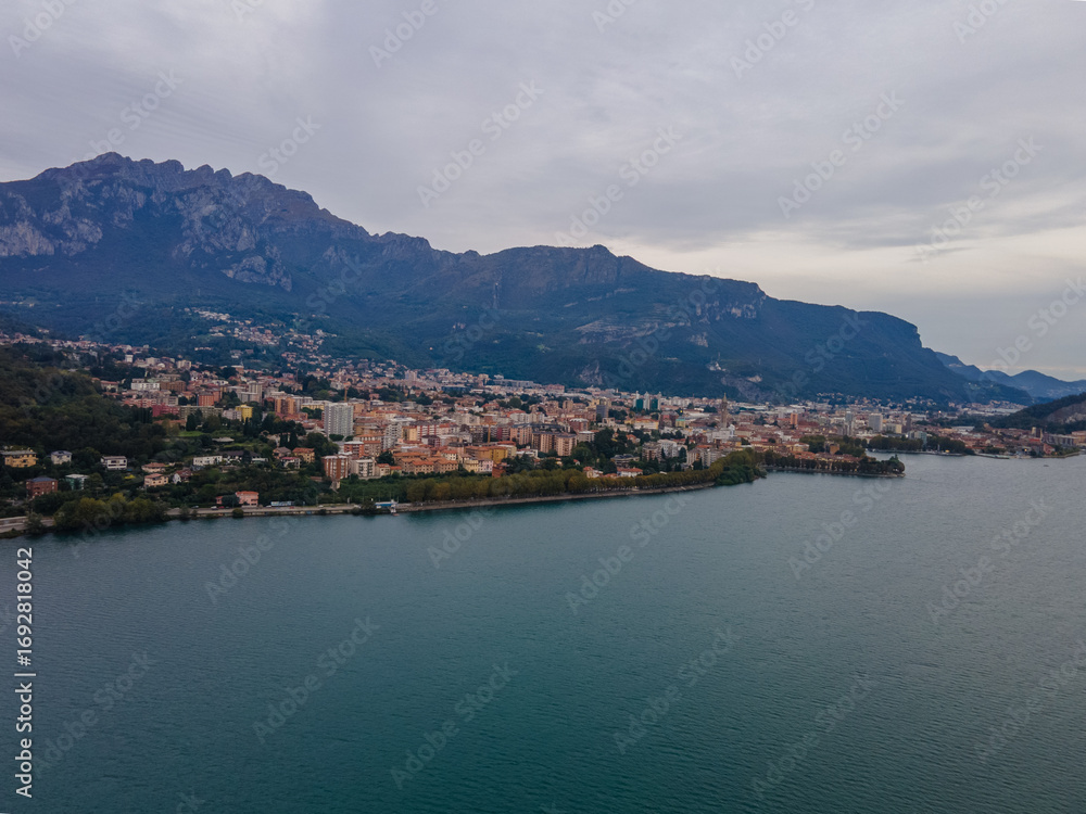 Fototapeta premium Aerial city landscape of Lecco village in Lake Como Italian Alps overcast fall day in Lombardy