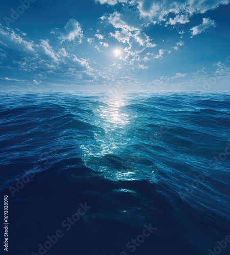 Vast ocean, sunlit waves, deep blue