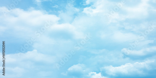 Blue clouds, sunny sunlight effect on the white fluffy clouds, rainy day, fresh natural weather background banner marketing image, surface splashed love day gift 
