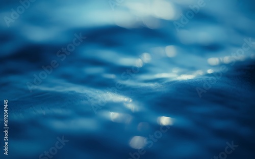 Deep blue water ripples with light reflections image