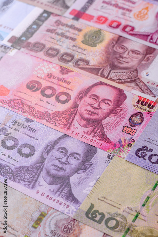Obraz premium Thailand paper money, dinar banknotes as currency for exchange or travel. Thai money