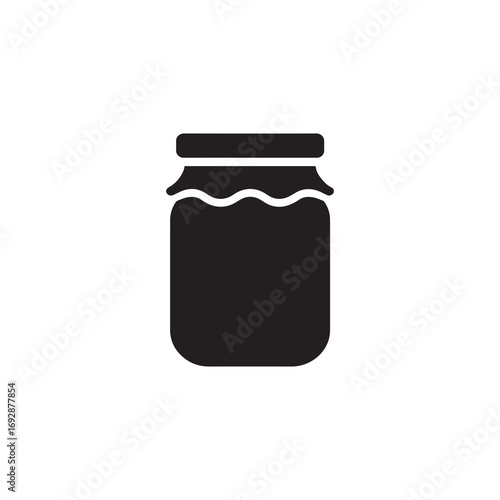 Glass jar filled with jam on white background