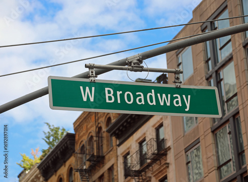 new york city intersection with large W Broadway street sign