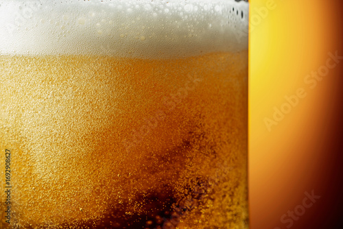 Glass of tasty beer with foam, closeup.