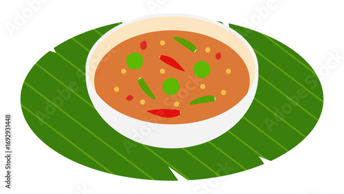 Thai shrimp paste chili dip (nam prik kapi) in a bowl on banana leaf