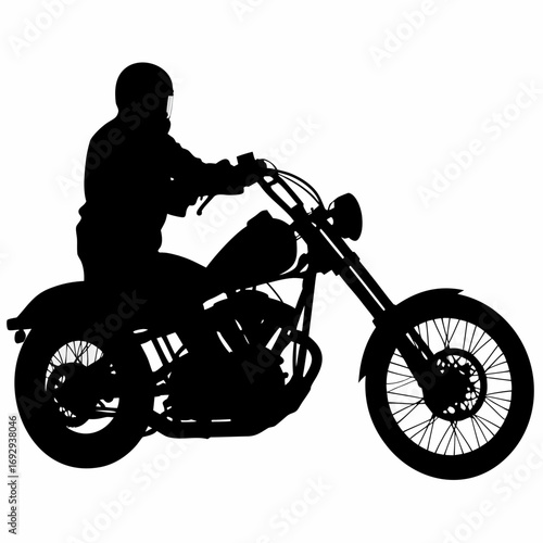 A silhouetted of Man riding a motorcycle