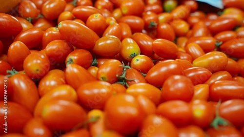 Healthy food, lots of Cherry Tomatoes, placed on a tray, slide back.
