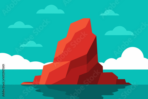 A large red rock formation in the ocean