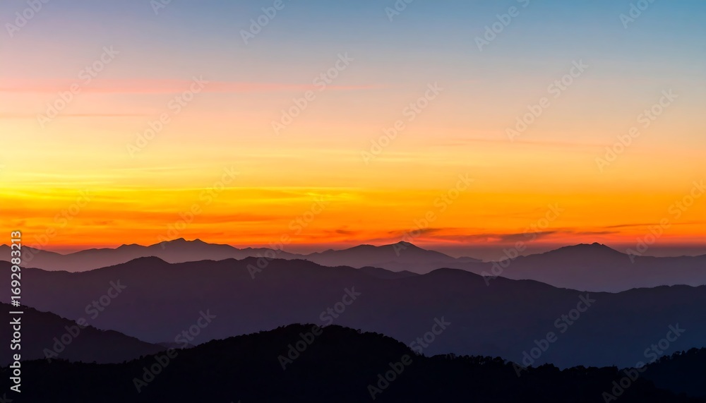 Obraz premium Sunrise over blurred mountain ranges
