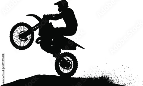 Silhouette of a man riding a motocross bike isolated on white background, performing a wheelie stunt