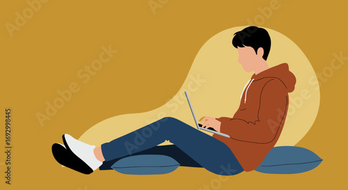 A relaxed person sitting on cushions, using a laptop for remote work, online learning, or digital leisure, depicting a modern lifestyle.