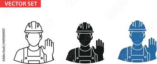 Construction worker in hard hat and overalls signals stop with raised hand