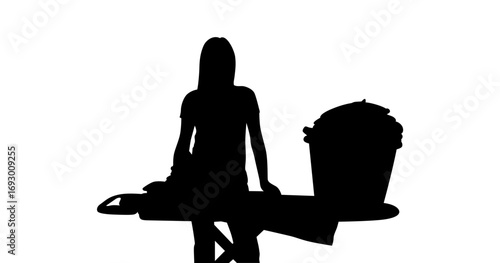 A simple, black and white silhouette of a woman ironing clothes.