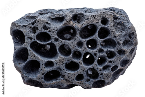A single piece of dark porous volcanic lava rock isolated.