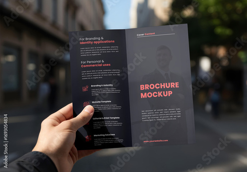Brochure in Hand Mockup