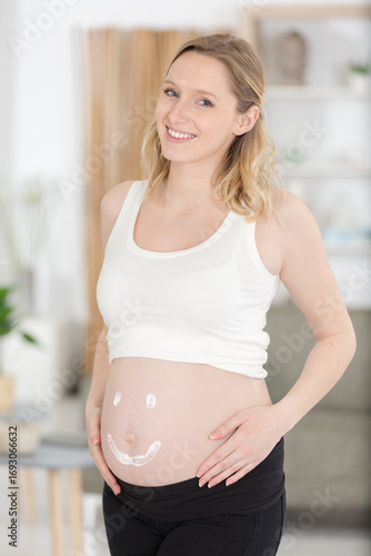 close up of pregnant belly with a cream heart Free Download close up of pregnant belly with a cream heart - GFXLoad