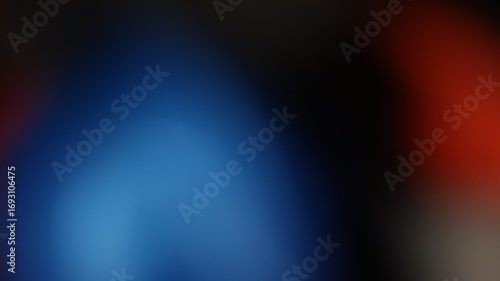 Blurred blue to red gradient on dark abstract canvas with soft transitions and moody visual contrast