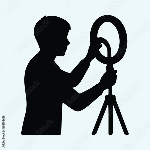 Illustrator Vector Person adjusting ring light equipment for recording silhouette