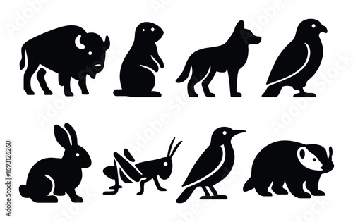 Wildlife silhouette icon set. featuring bison, prairie dog, wolf, eagle, rabbit, grasshopper, bird, badger.